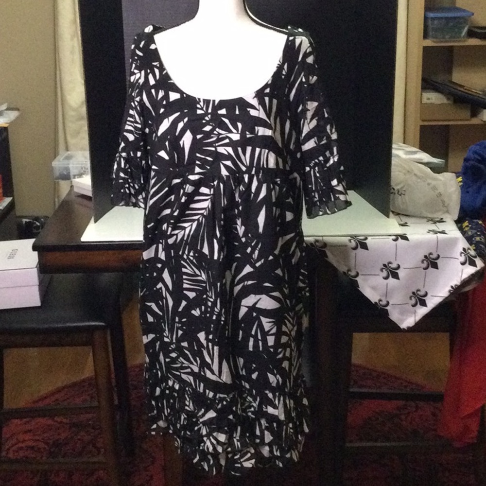 Black Dress with Leaf Designs Throughout Ruffle Bottom and Sleeves